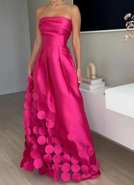 Elegant women's fuchsia strapless A-line maxi dress with petal hem, perfect for wedding guests & formal evening events.