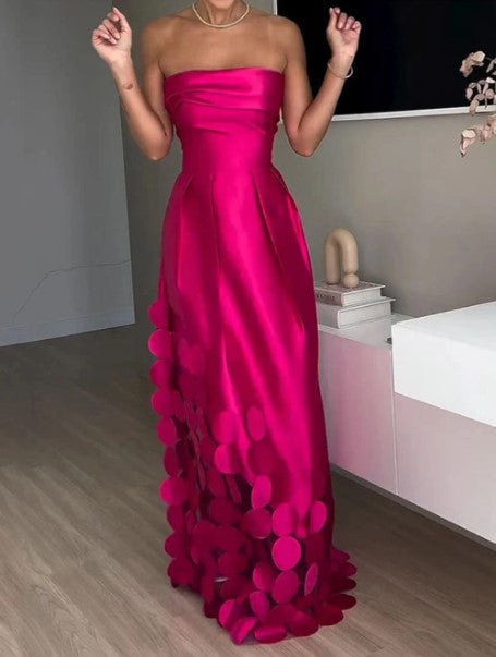 Glamorous strapless fuchsia maxi gown for women. Ideal wedding guest dress with a chic A-line silhouette & petal hem.