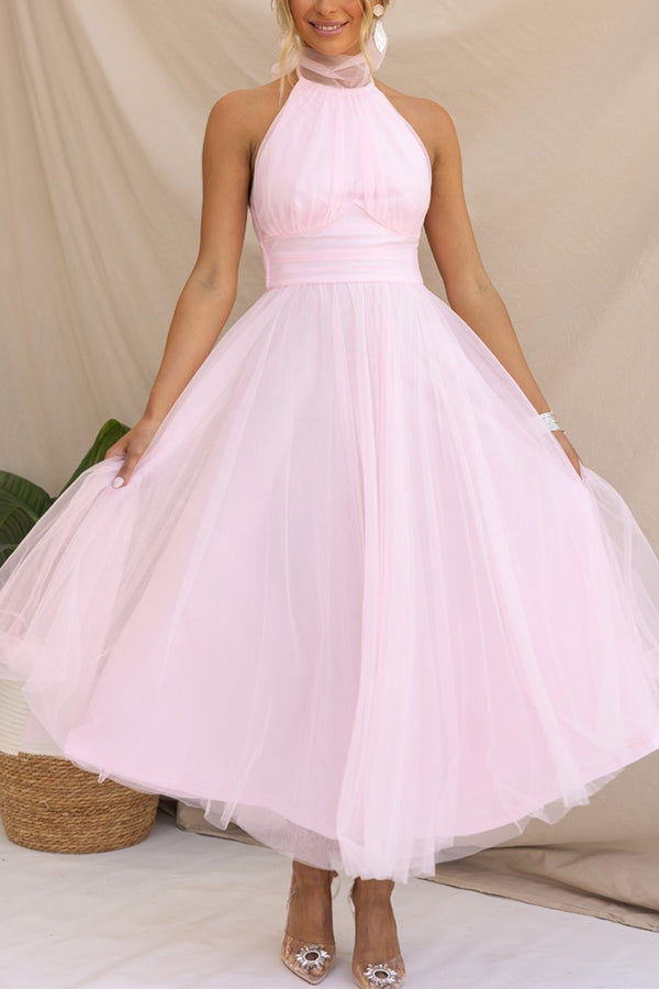 Stylish women's elegant halter maxi dress, versatile as a formal wedding guest or evening event gown.