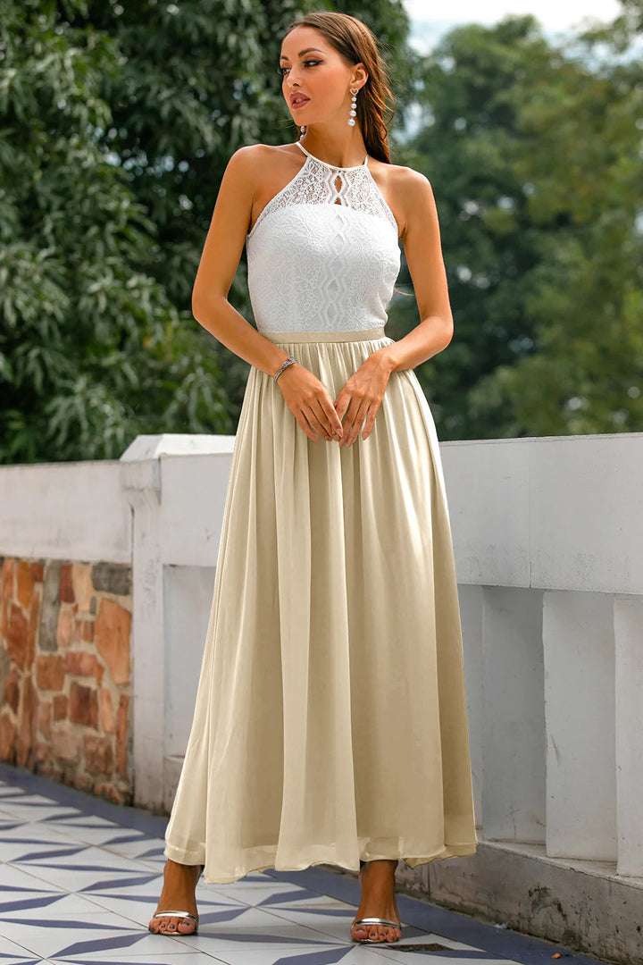 Woman posing in a chic halter neck maxi dress, appropriate for various formal events.