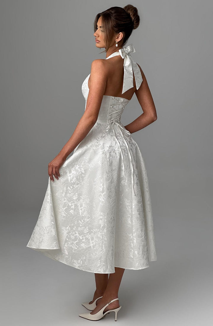 Beautiful women's party dress featuring a refined halter neck and comfortable midi length