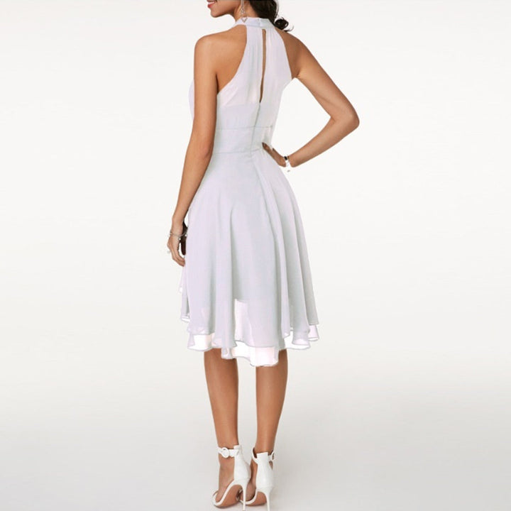 Women's party dress: elegant halter neck mini with a flowing layered hem. Ideal for cocktails or evening events.