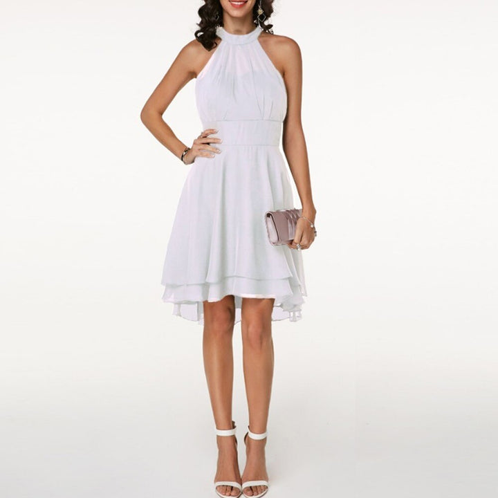 Dynamic women's halter neck mini dress with a vibrant, flowing layered hem. Great for parties & events.