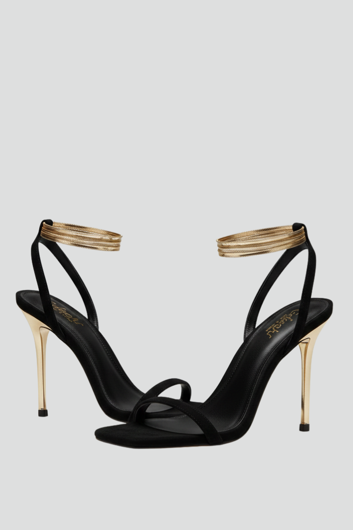 Elegant women's heeled sandals with thin straps, wrap-around ankle strap, and slim heel for dressy occasions.