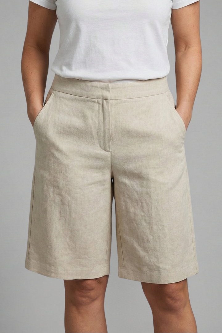 Chic flat-front knee-length tailored shorts for women, offering comfort and style for summer fashion.