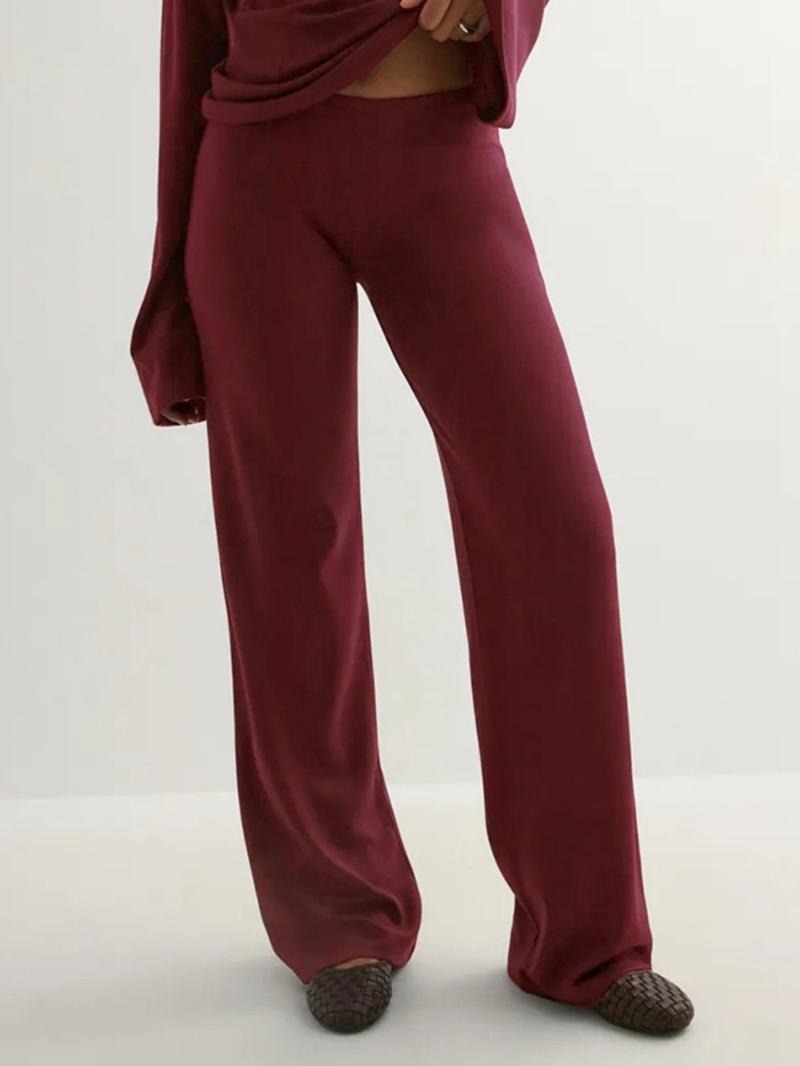 Luxury women's knitwear lounge set with an elegant top and chic wide-leg pants, matching