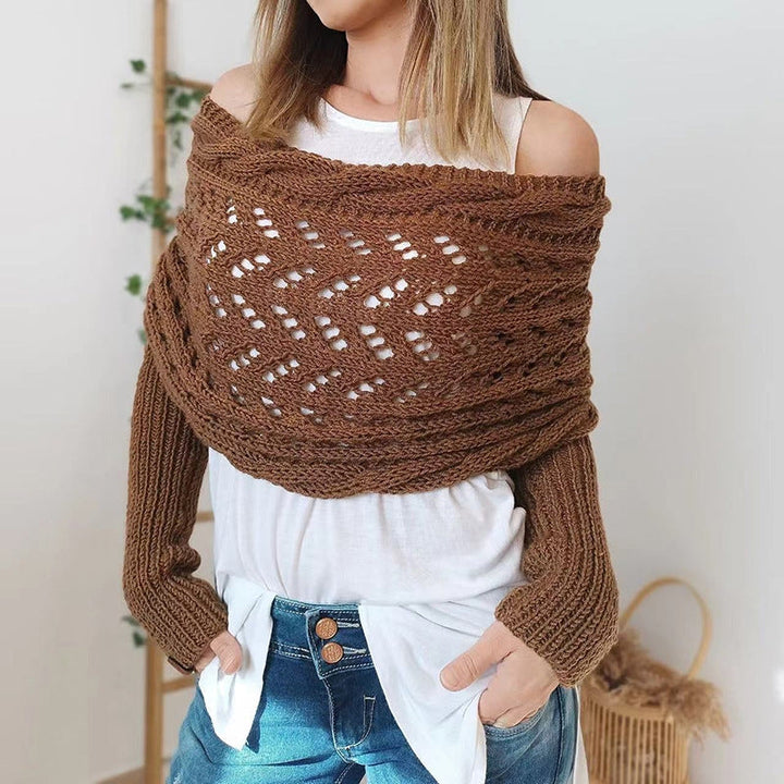 Close-up of a women's knitted scarf with sleeves, showcasing the soft texture and detailed knit.