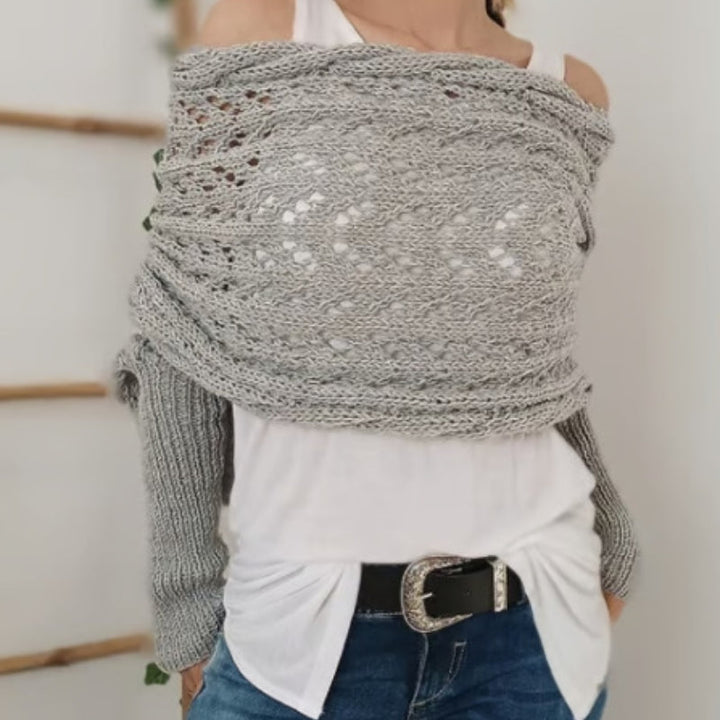 Versatile women's knitted scarf with sleeves, offering warmth and a chic look for winter outings.