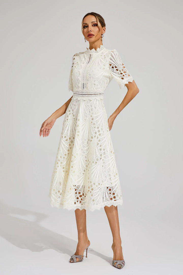 Sophisticated women's lace midi dress, perfect for an elegant spring wedding.