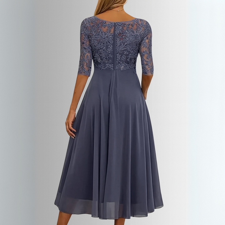 Stylish women's lace midi dress, half sleeves, elegant A-line layered skirt for a flattering fit. Perfect party outfit.