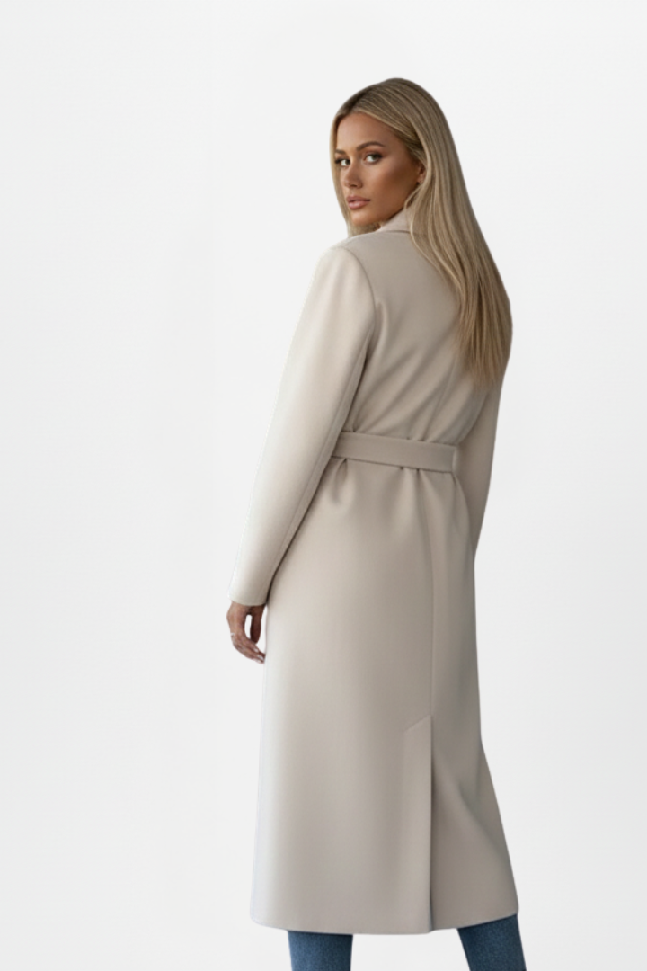 Stylish women's long winter coat, double-breasted front, and a cinching belt. Essential elegant outerwear.