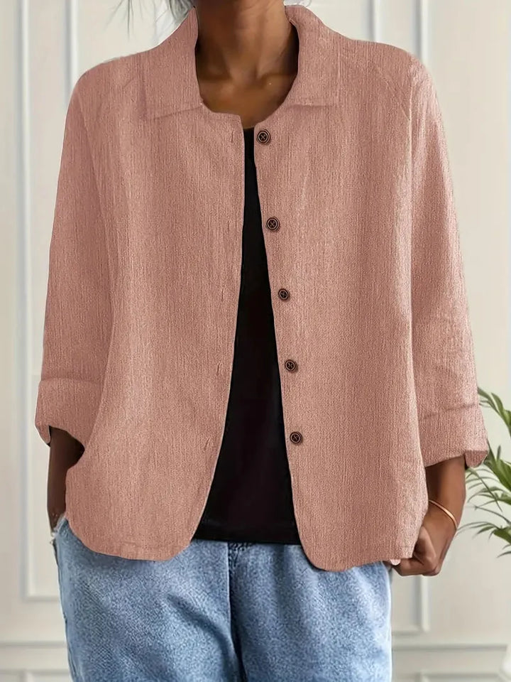 Women's versatile button-up blouse with a collared neckline and long sleeves, an elegant everyday top.