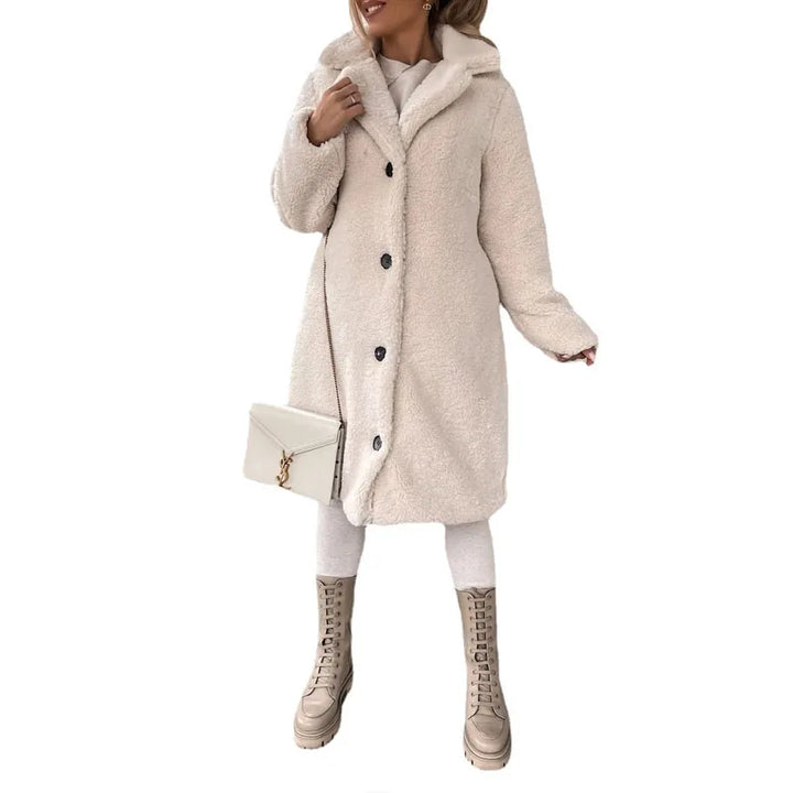 Stylish women's faux shearling long coat, a warm and elegant winter jacket, essential for cold weather fashion.