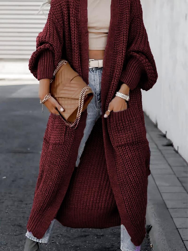 Chunky knit women's longline cardigan in a cozy wool blend, ideal for elegant winter outerwear.