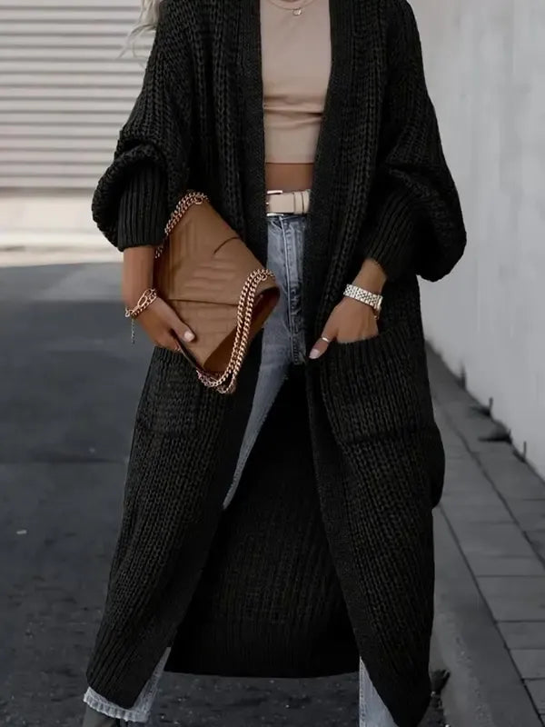 Cozy women's longline cardigan, chunky knit and wool blend, a perfect piece of elegant winter outerwear.