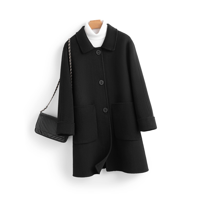 Elegant women's luxury cashmere longline coat, perfect for winter. Exudes warmth and sophisticated style.