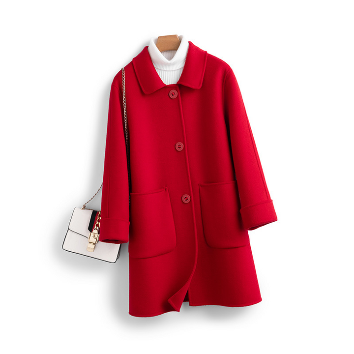 Fashionable women's cashmere longline coat. A warm and elegant outerwear piece for cold weather.