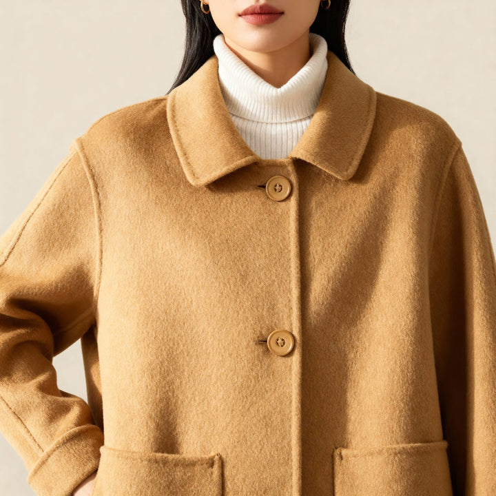 Stylish women's longline cashmere coat, offering warmth and a chic look for any winter occasion.