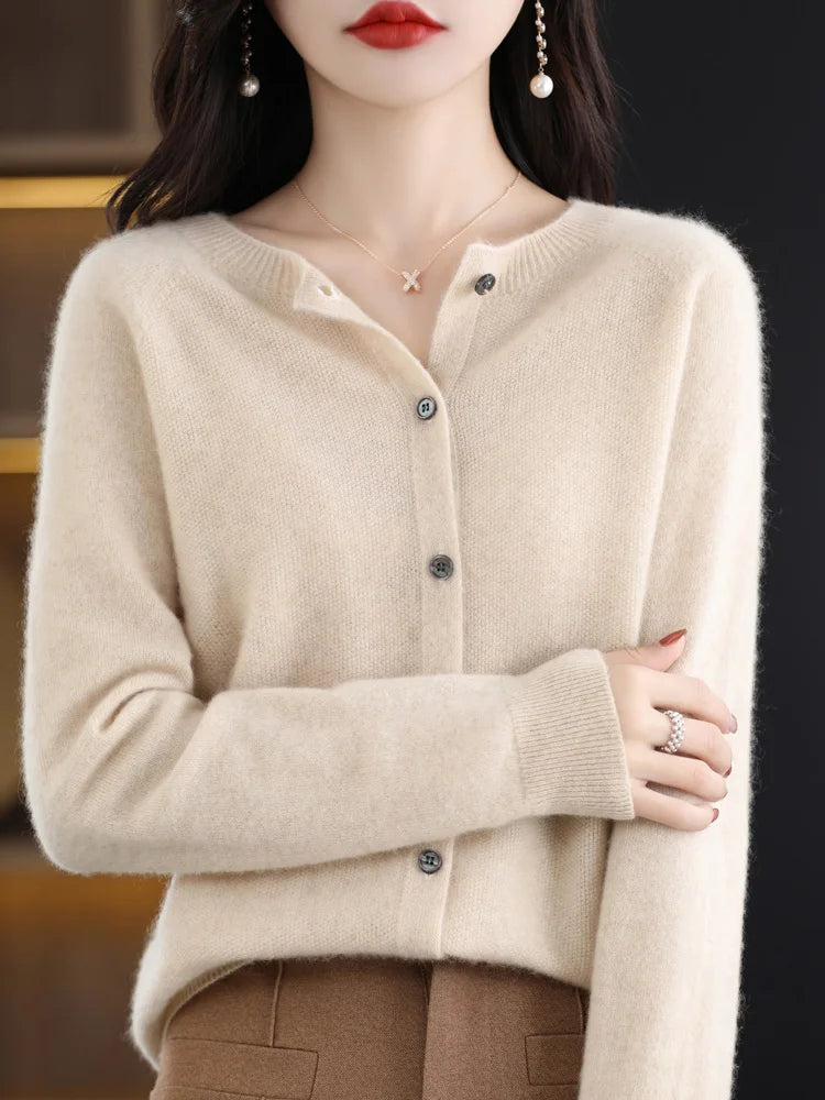Model wearing a women's elegant merino wool fine-knit O-neck sweater, showcasing its drape