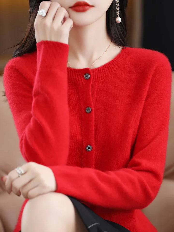 Folded women's soft merino wool O-neck sweater, presenting its luxurious feel and warmth