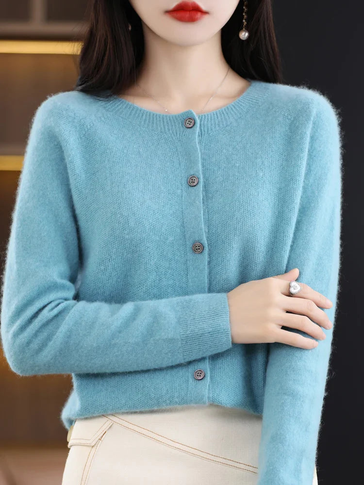 Close-up of a women's fine-knit O-neck sweater, highlighting the soft texture of merino wool
