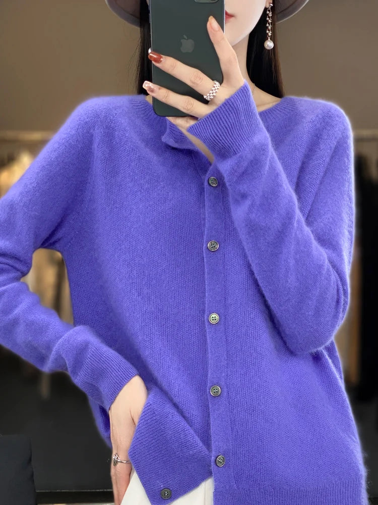 Women's soft merino wool O-neck sweater in a neutral hue, perfect for elegant layering