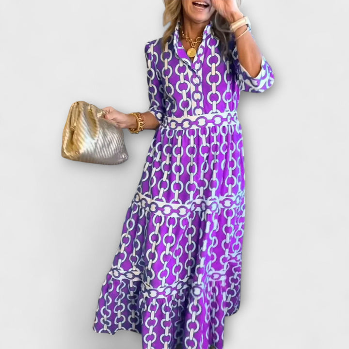 Fashionable women's elegant midi dress with a unique chain print. Great for parties or chic everyday style.