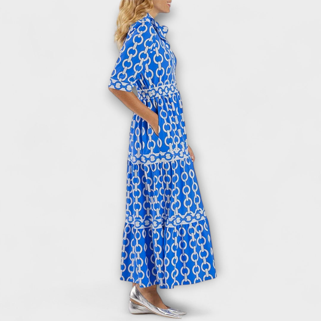 Chic women's elegant midi dress with a bold chain pattern. A versatile fashion statement for women.