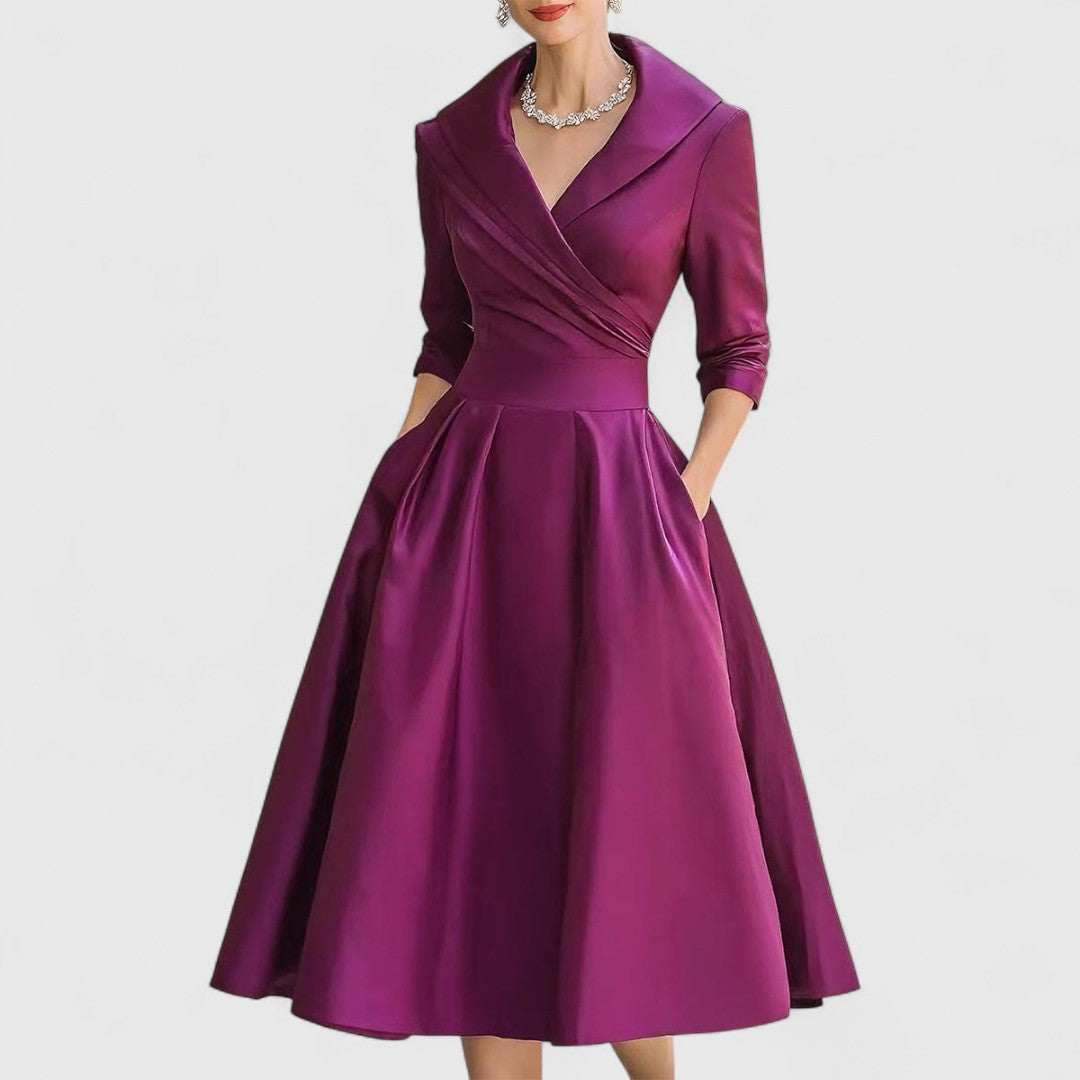Chic women's V-neck midi dress with 3/4 sleeves. Offers a flattering, comfortable fit for any occasion.