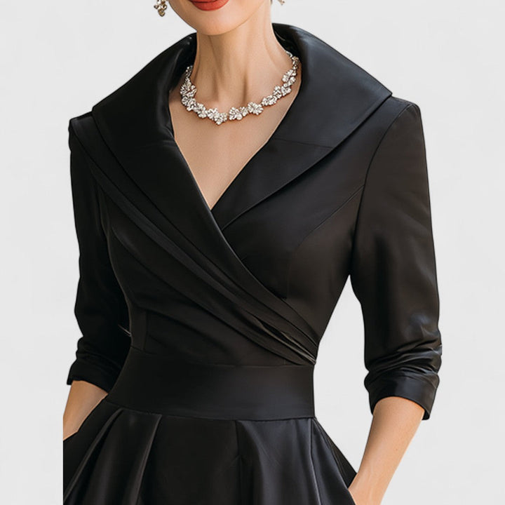 Women's fashionable midi dress. Elegant V-neck, 3/4 sleeves, and a flattering fit for sophisticated style.
