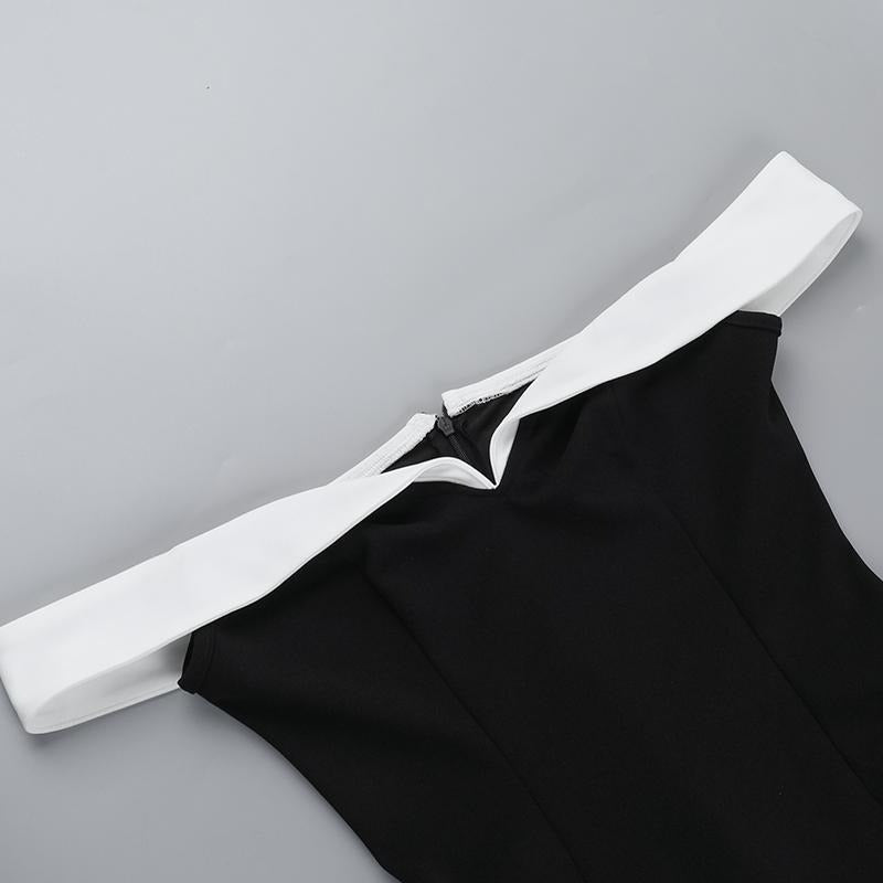 Close-up of the contrast neckline on an elegant black mini dress for women, showing detail