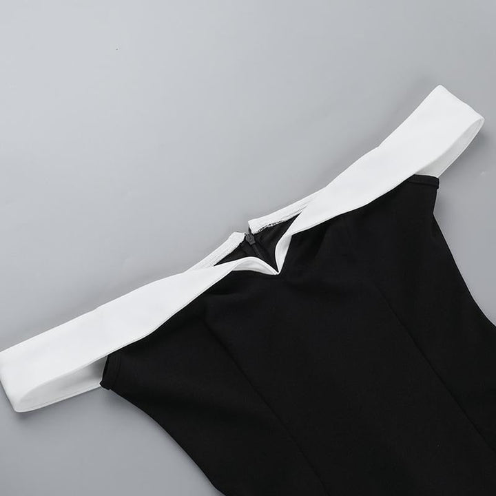 Close-up of the contrast neckline on an elegant black mini dress for women, showing detail
