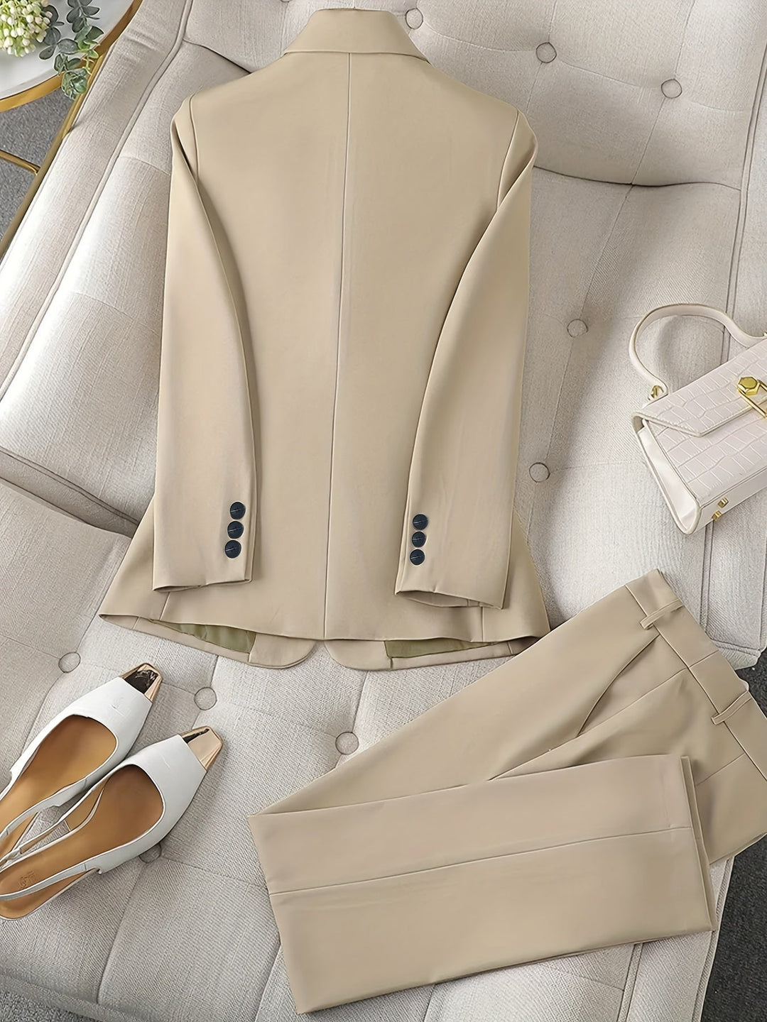 Women's professional pant suit with a chic notched lapel blazer, ideal for business and formal events.
