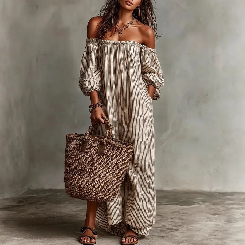 Elegant women's off-shoulder maxi dress with puff sleeves, perfect for summer parties.