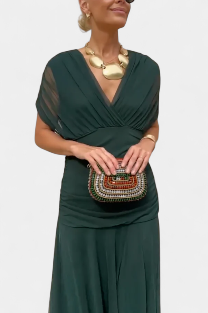 Party-ready women's off-shoulder dress, ruched and twisted for a sophisticated, flattering look.