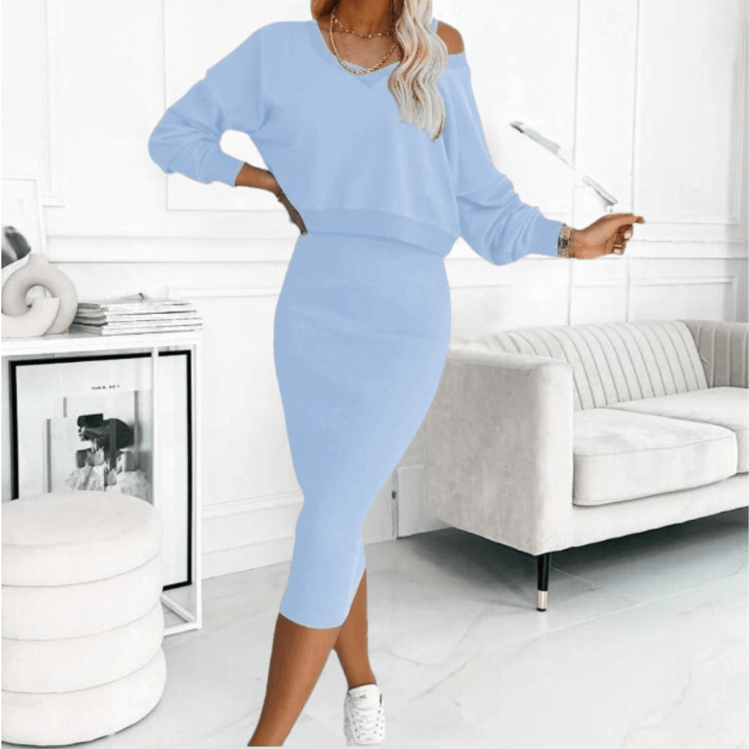 Women's off-shoulder top and midi skirt set in a breathable fabric, perfect for warm weather style.