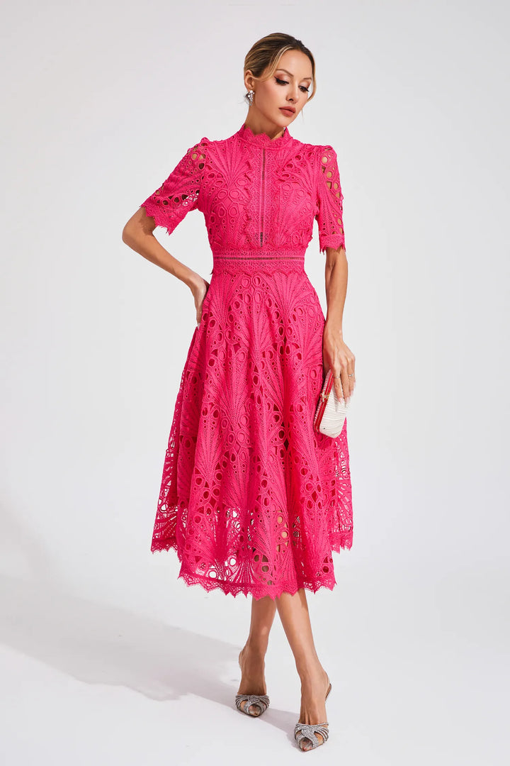 Full shot of a model wearing a women's elegant white lace midi dress, graceful pose