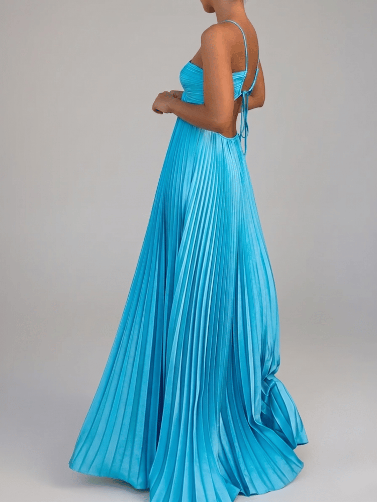 Women's elegant pleated A-line maxi dress. Flowy summer formal or casual gown, backless design for special events.