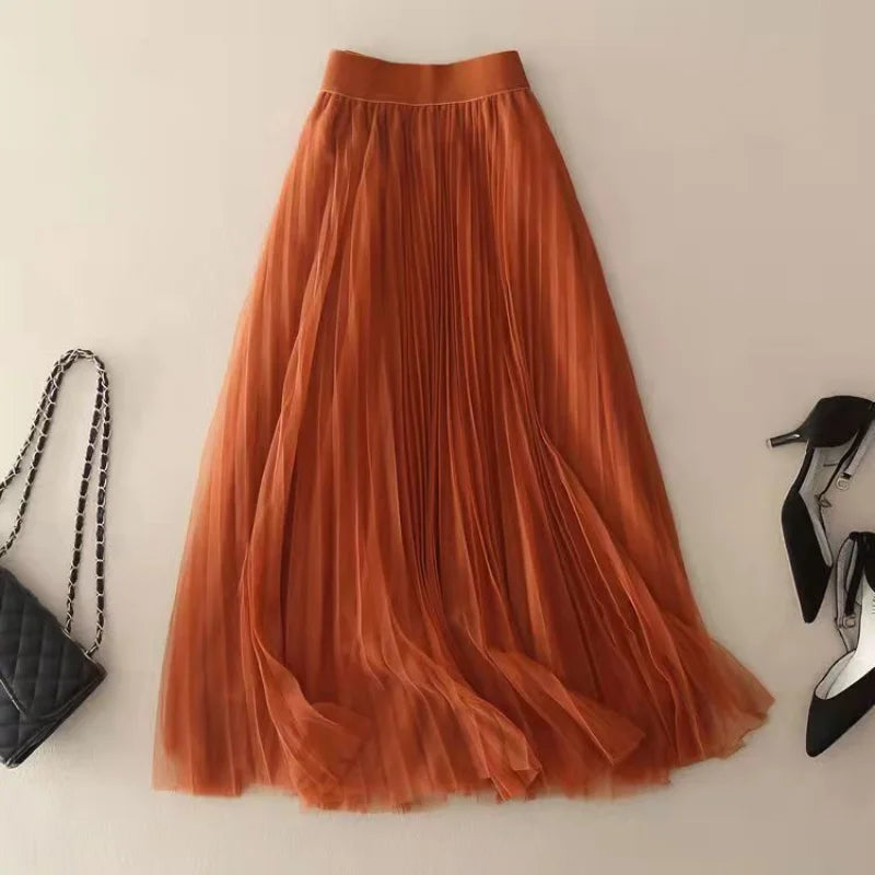 High-waist pleated midi skirt for women. Flowy, elegant, and versatile for casual or dressy summer looks.