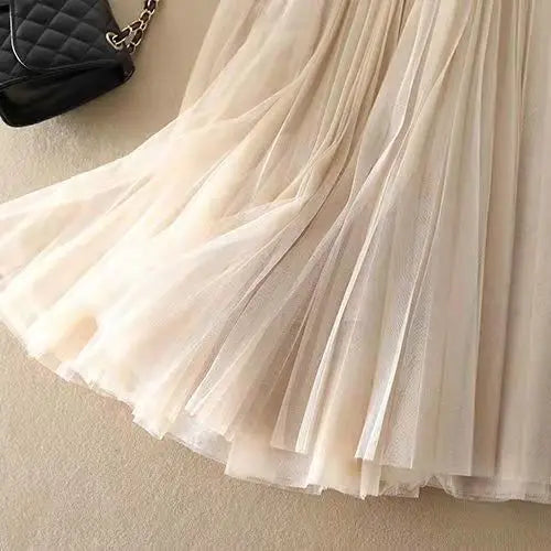 Summer chic women's high-waist pleated flowy midi skirt. Elegant and versatile fashion essential for warm weather.