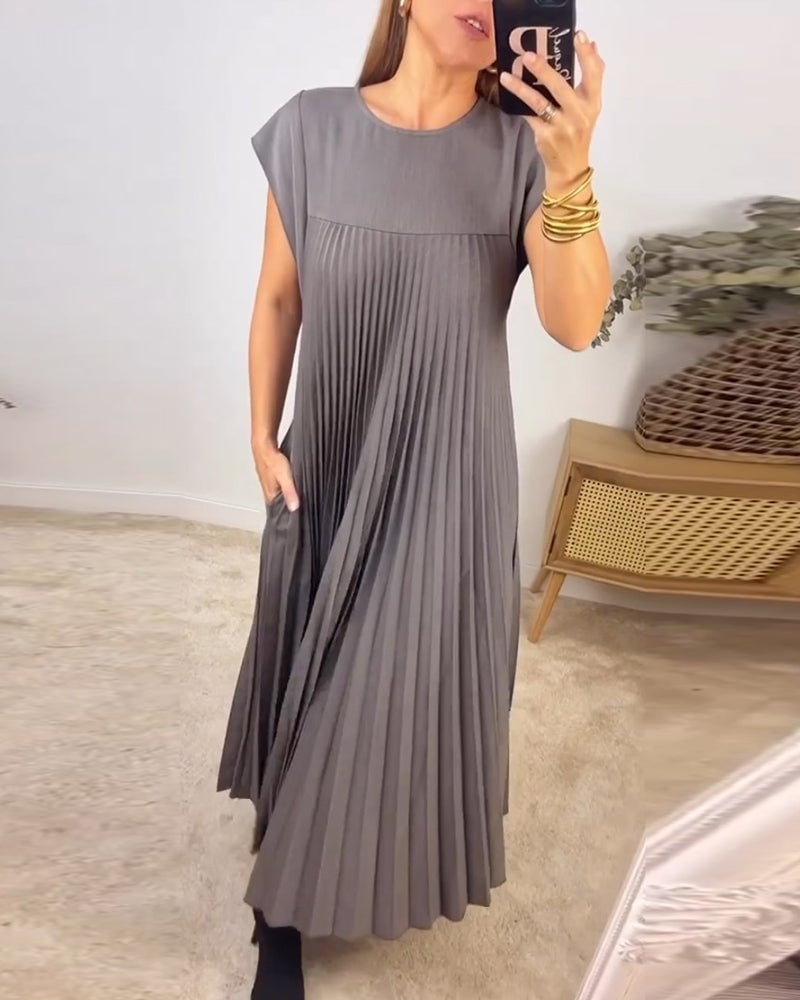 Feminine pleated maxi dress for women, with elegant cap sleeves and a flattering empire waist.