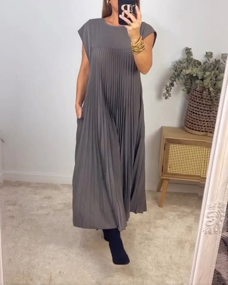 Women's occasion dress: Flowing pleated maxi, extended cap sleeves, relaxed empire waist for comfort.