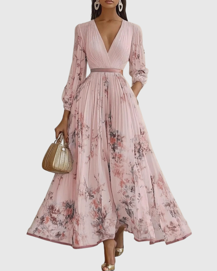 Vibrant floral print women's maxi dress, pleated with long sleeves. Elegant V-neck design, perfect for any occasion.
