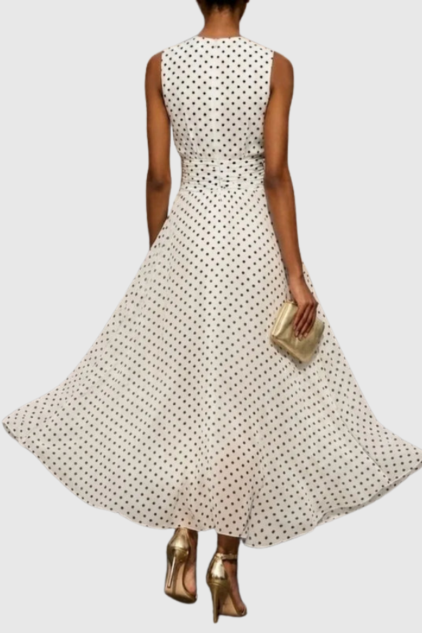 Stylish A-line polka dot maxi dress for women, featuring a halter neck and ruffle hem, ideal for summer.