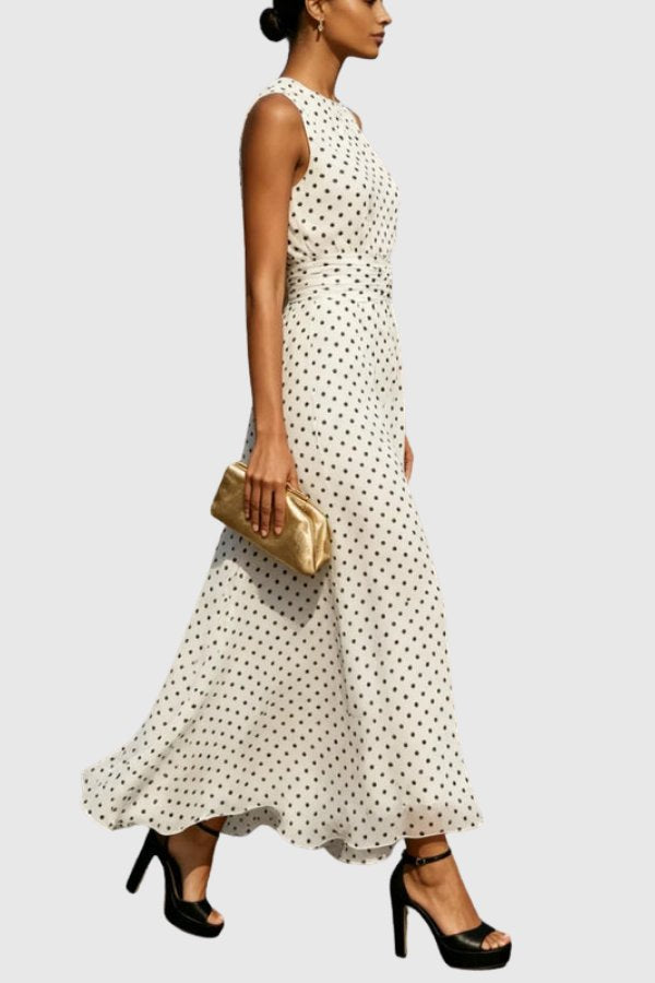 Women's elegant black & white polka dot maxi dress featuring a stylish ruffle hem for parties.