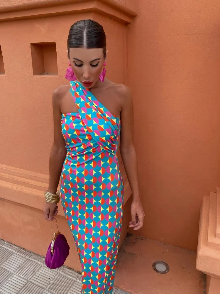 Women's elegant floral printed maxi dress with a unique one-shoulder neckline for occasion wear.