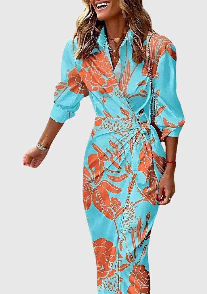 Back view of elegant women's printed wrap dress, highlighting the flattering wrap style and long design.