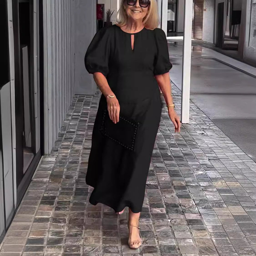 Stylish party dress: women's elegant puff-sleeve midi. Timeless fashion for cocktail & events.