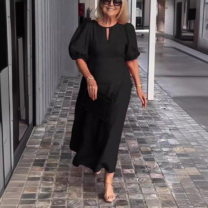 Stylish party dress: women's elegant puff-sleeve midi. Timeless fashion for cocktail & events.