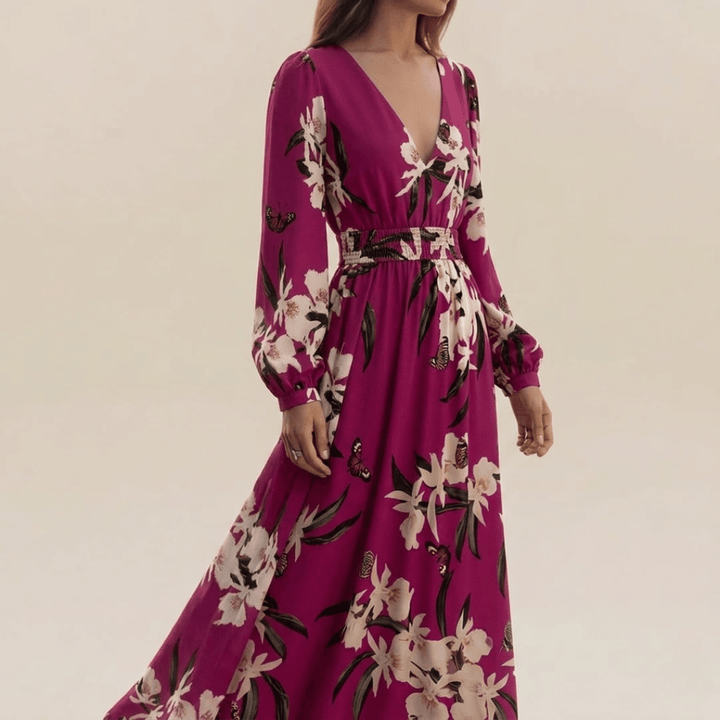Stylish women's long sleeve floral maxi dress in purple. Versatile v-neck design, ideal for elegant or casual wear.